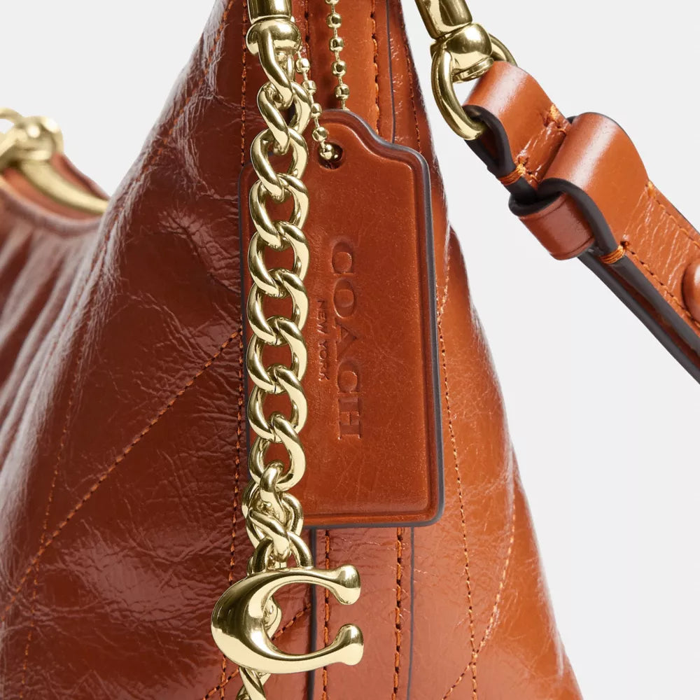 Caitlin Shoulder Bag With Quilting And Charm - Gold/Cinnamon